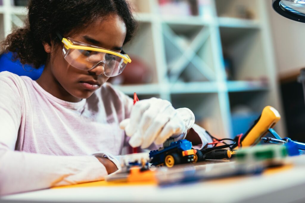 Girl is Working on a Robot